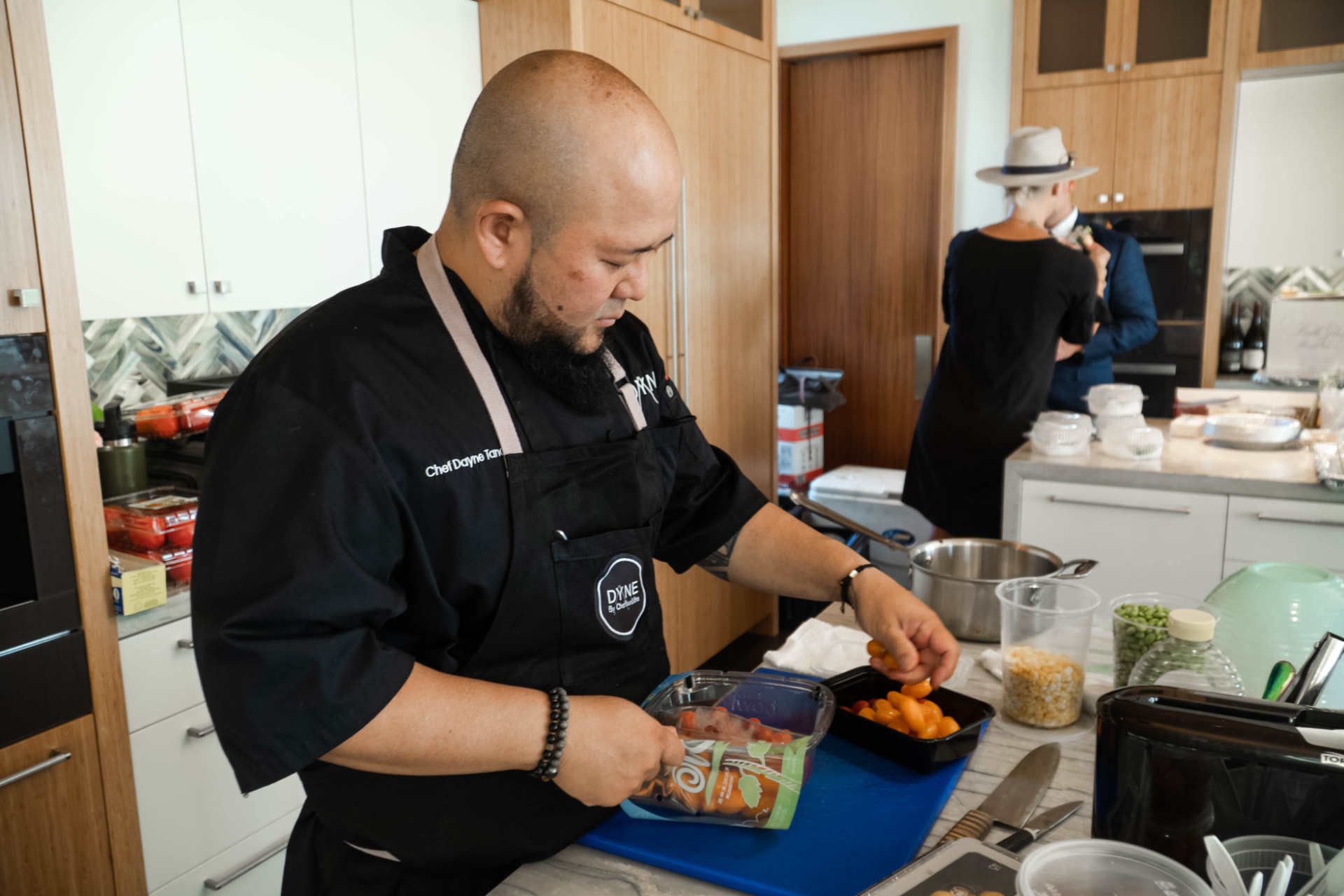Chef Dayne and his team plating canapés in an event kitchen