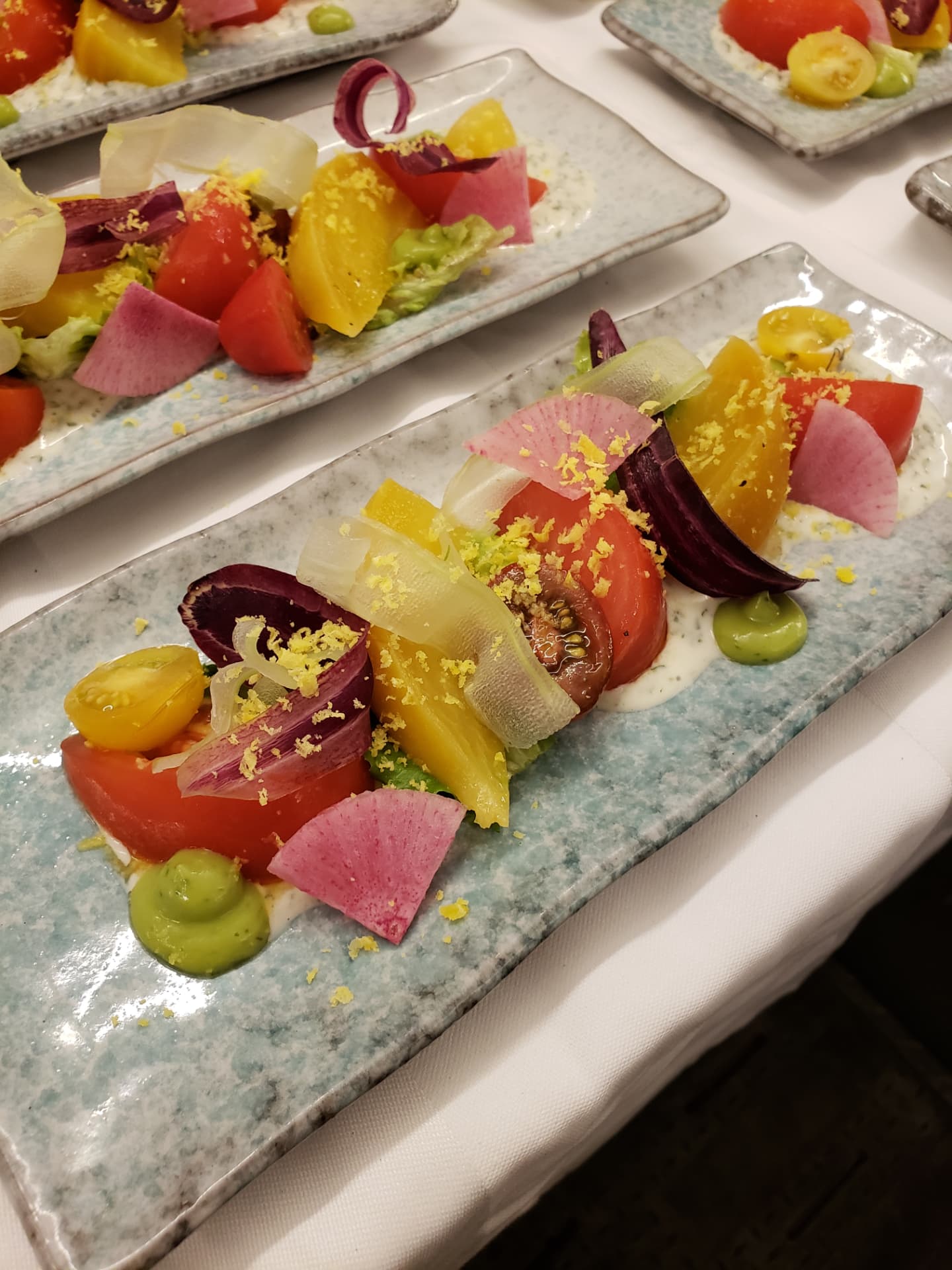 Heirloom tomato salad with avocado, radish and pickled vegetables